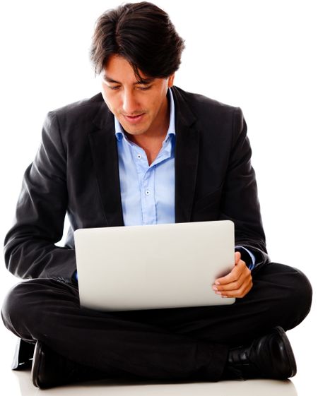 Businessman working on a laptop - isolated over a white background