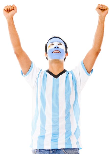 Excited Argentinean man with arms up celebrating - isolated over white