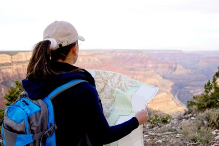 Adventurous female at the Grand Canyon holding a map