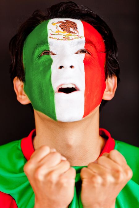 Excited Mexican man shouting - isolated over a black background