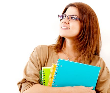 Thoughtful female student holding notebooks - isolated over a white background