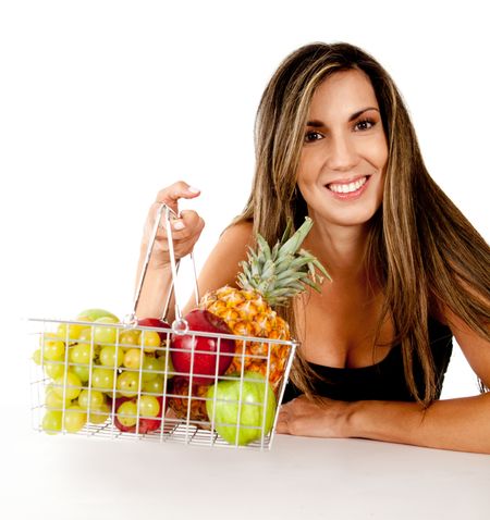 Healthy eating woman with a basket of fruits Ã?Â?Ã?Â� isolated over white