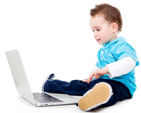 Little boy with a laptop computer - isolated over a white background