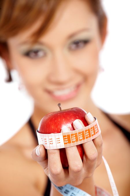 healthy woman holding a red apple fruit isolated over a white background