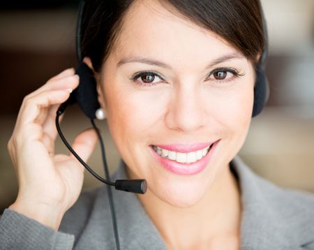 Female customer support operator with a headset