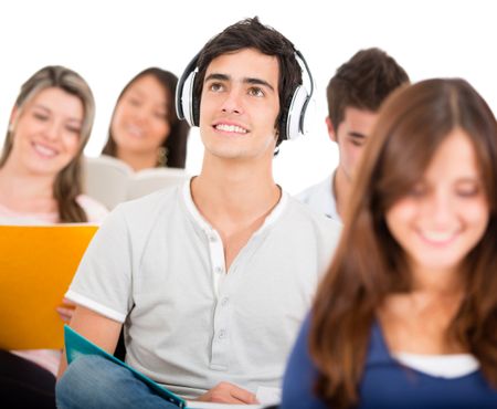 Student listening to music in class with headphones