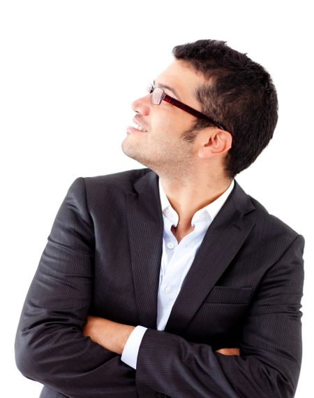 Businessman looking up and wearing glasses - isolated over a white background