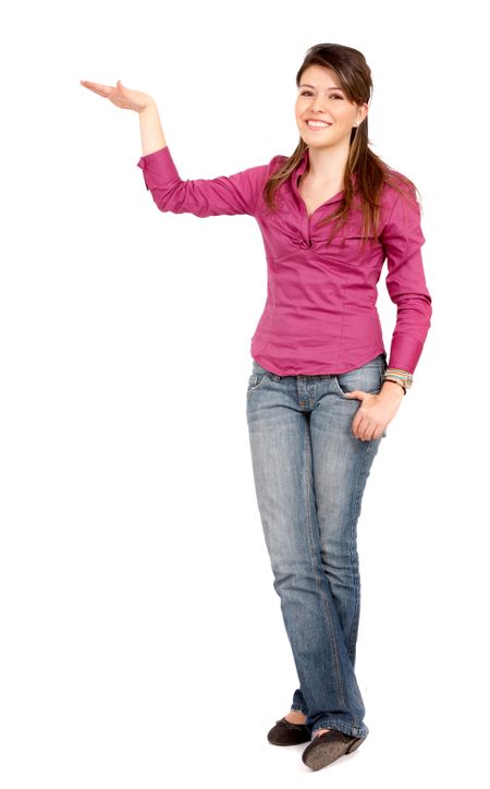 casual woman smiling displaying something isolated over a white background
