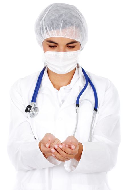 female doctor holding something in her hands isolated over a white background