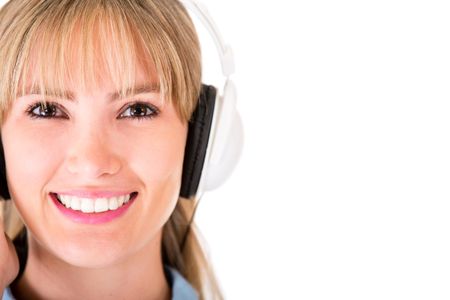 Woman with headphones listening to music - isolated over a white backgorund