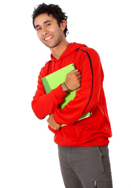 casual college student smiling and holding some notebooks isolated over a white background