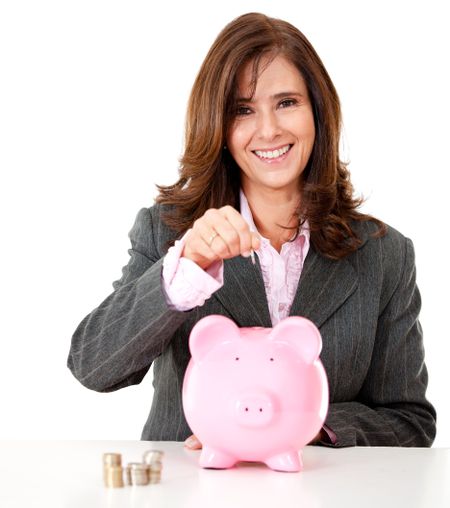 Business woman saving in a piggybank - isolated over a white background