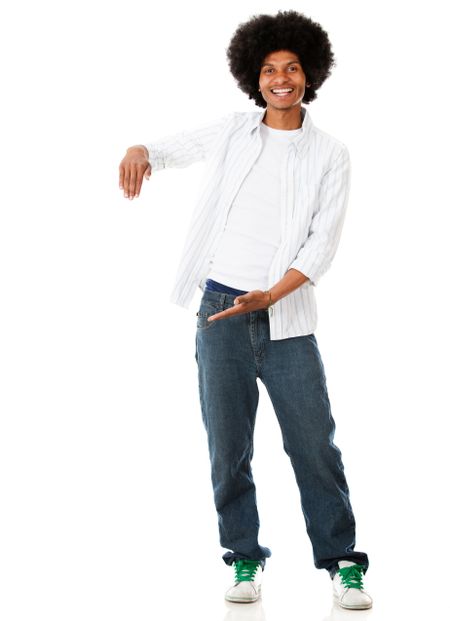 Happy black man displaying something with his hands - isolated over white
