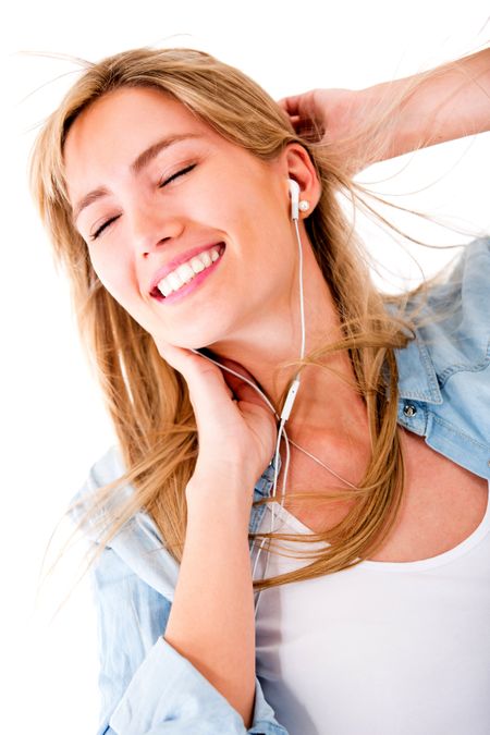 Woman relaxing and listening to music - isolated over a white background
