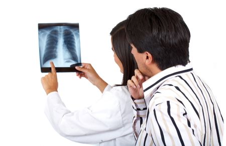 doctor and patient checking an xray isolated over a white background