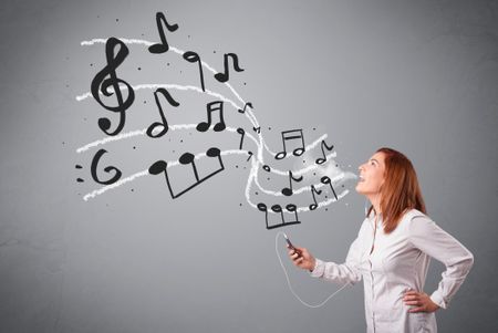 attractive young lady singing and listening to music with musical notes getting out of her mouth