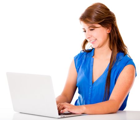 Woman working on a laptop computer - isolated over a white background