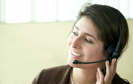 beautiful business customer service woman - smiling at the office