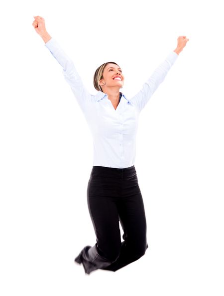 Successful businesswoman jumping with arms up - isolated over white