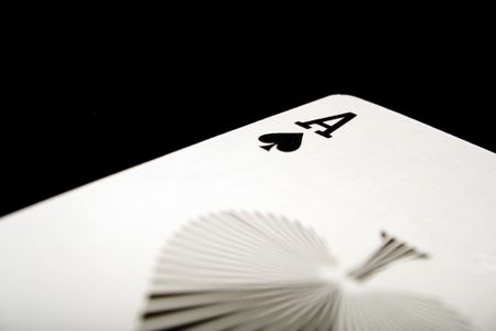 ace of spades on black background