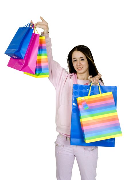 pretty teen with her shopping bags over a white background