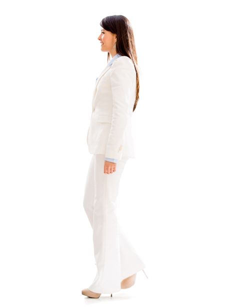 Business woman walking to the side - isolated over white