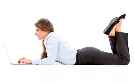 Business woman working online with a laptop - isolated over white