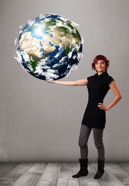 Pretty young girl holding 3d planet earth, elements of this image furnished by NASA