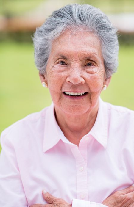 Portrait of a retired woman looking very happy