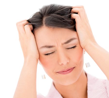 Portrait frustrated woman with a headache - isolated over white background
