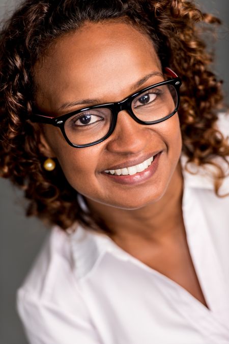 Portrait of a business woman wearing glasses and smiling