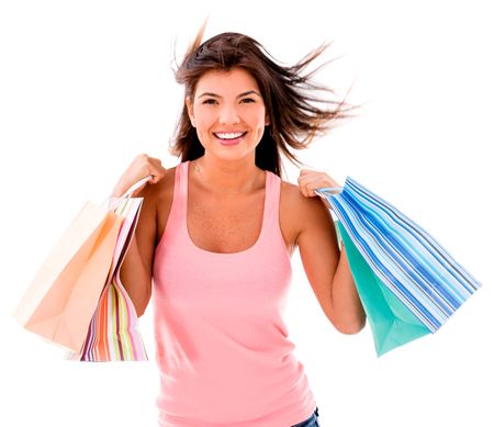 Happy shopping woman having fun - isolated over white background