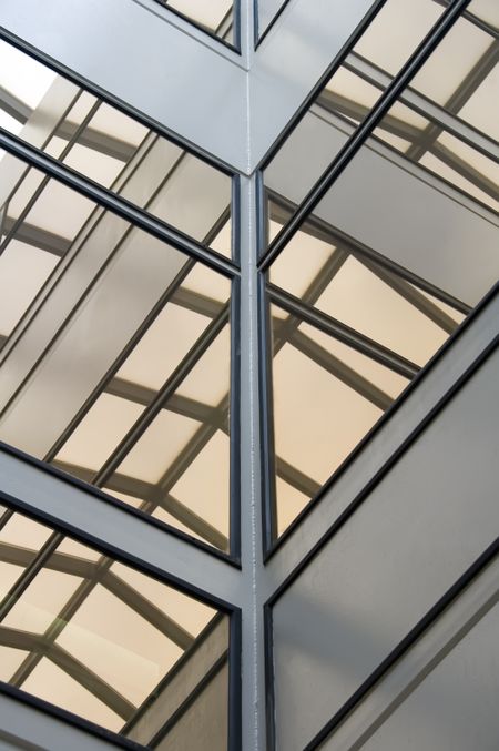 Corner of atrium with windows reflecting skylight