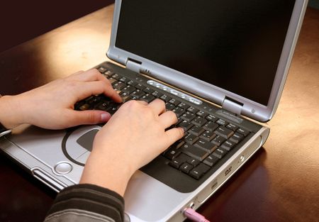 Girl typing on laptop