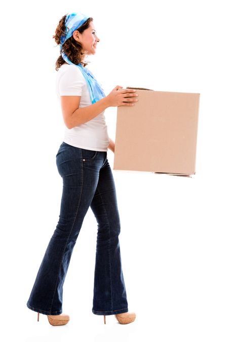 Woman moving house and carrying a box - isolated over white 