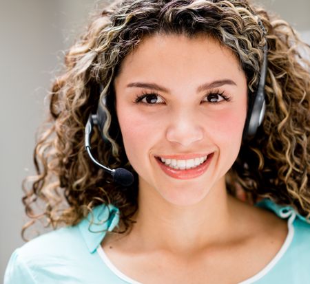Happy woman with a headset - telemarketing agent concepts 