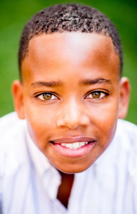Portrait of an African American boy smiling at the park 
