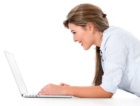 Happy woman browsing on a laptop computer - isolated over white background 