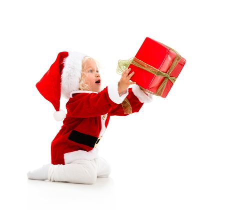 Girl dressed as Santa giving a Christmass gift - isolated over white 