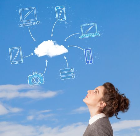 Casual young girl looking at cloud computing concept on blue sky