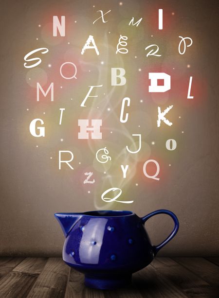 Tea pot with colorful letters, close up