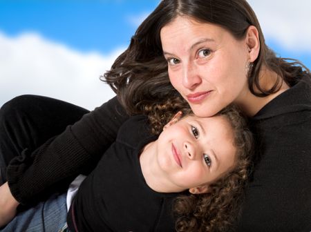 happy mum and daughter with sky in the background - clipping path included to remove the sky from the background