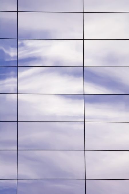 Reflection of morning sky in windows of high-rise on college campus