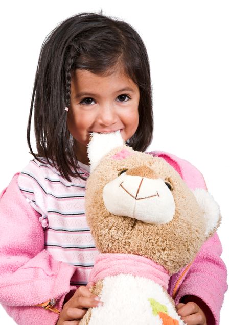 little girl playing with her teddy over white