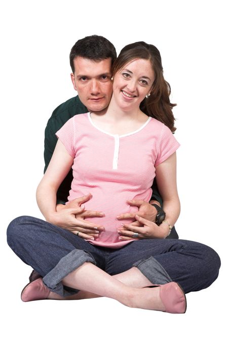 beatiful pregnant couple over a white background