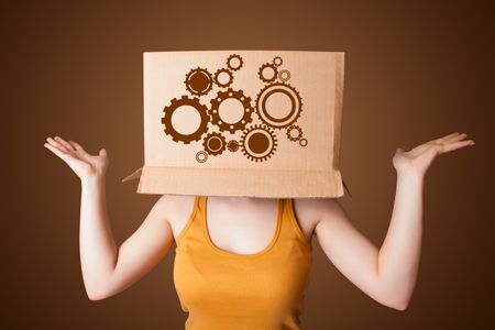 Young woman standing and gesturing with a cardboard box on his head with spur wheels