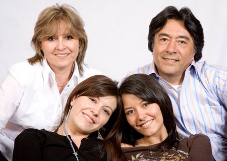 latin american family over a light grey background