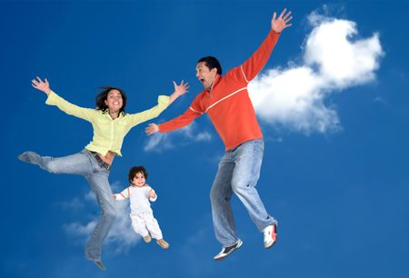 happy family in the air over a beautiful blue sky - focus is on the child