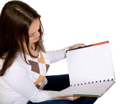 beautiful student with her notebook over a white background