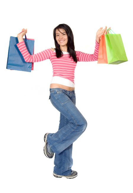 beautiful girl with shopping bags over white background